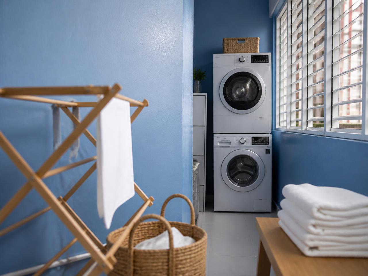 Zinsser Perma-White tinted to PXA-5633 Cobalt Muslin eggshell on an HDB service yard laundry wall in Singapore, resisting mould in the wettest room